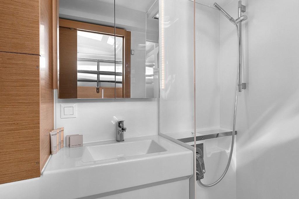 Head with vanity and glass shower