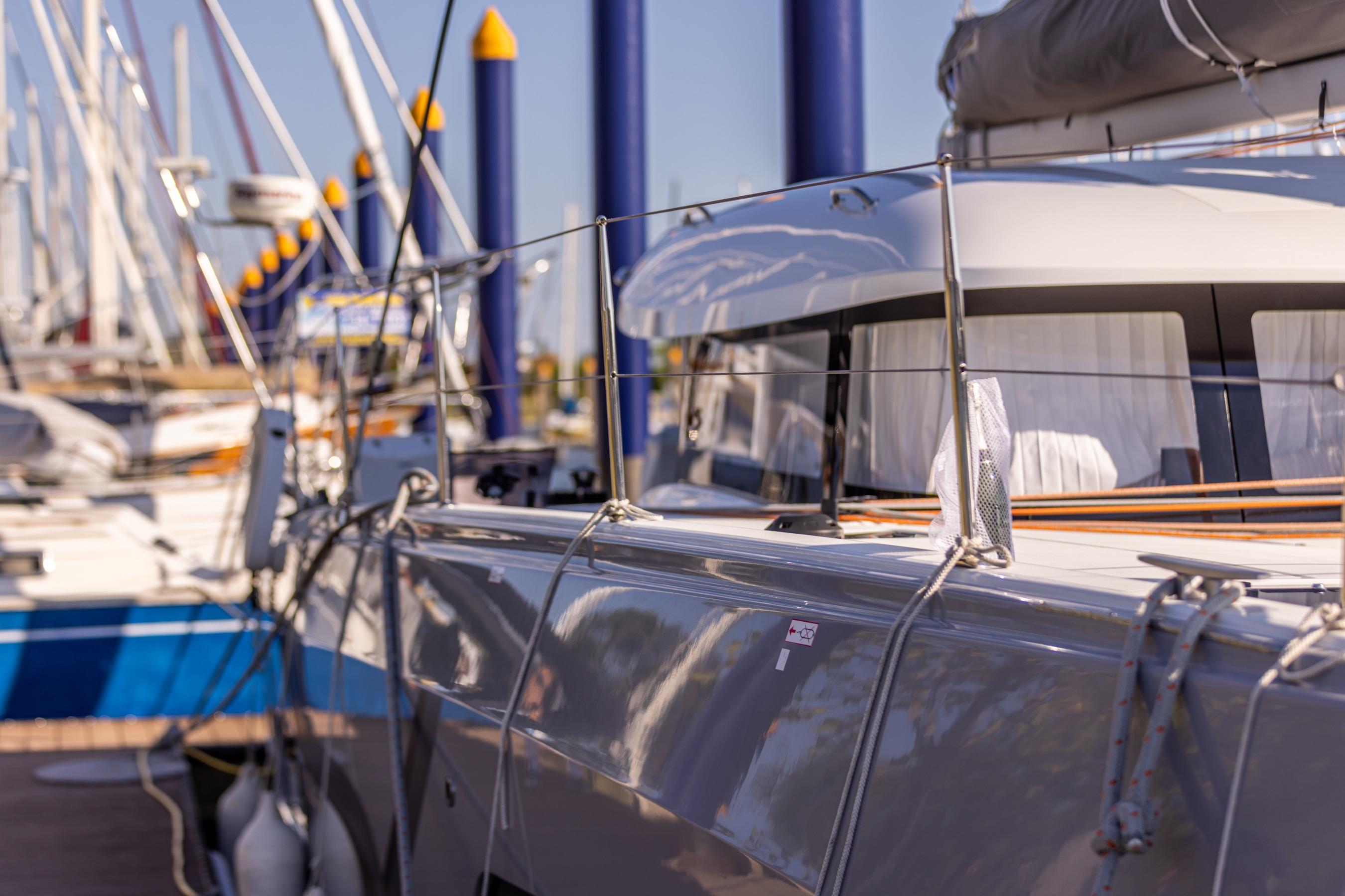 Hull and side-deck detail in the marina